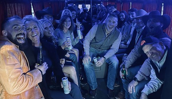 A group of people are sitting on a bus.